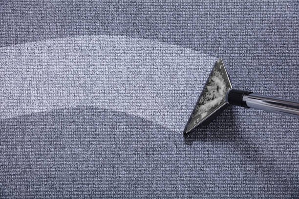 Close-up Of A Vacuum Cleaner Over Grey Carpet